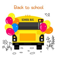 School bus with colorful balloons and a sign back to school.