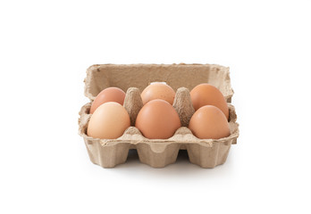 Fresh brown eggs in carton on isolated