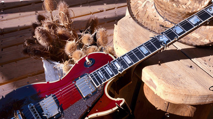 electric guitar behind the glass with water drops . closeup