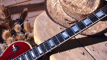 electric guitar behind the glass with water drops . closeup