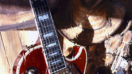 electric guitar behind the glass with water drops . closeup