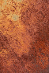 Rusty yellow-red textured metal surface. The texture of the metal sheet is prone to oxidation and corrosion. Textured background in grunge style