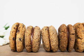 Delicious hazelnut and almond sandwich biscuits with chocolate, ganache and gianduja filling. Baci di dama (Lady's kisses) - italian cookies from Piedmont.
