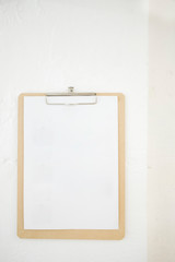 clipboard on white wall