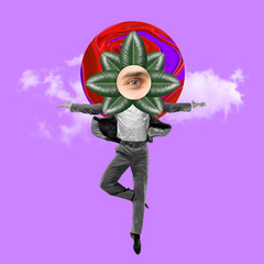 Dancing office man in grey suit like a ballet dancer or performer with the green leaves as a head...
