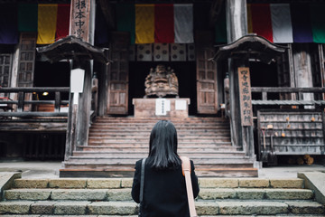 women pray atJapan temple shrine