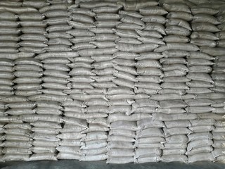 The product white stock is packed in sacks, stacked in the warehouse, waiting for delivery.