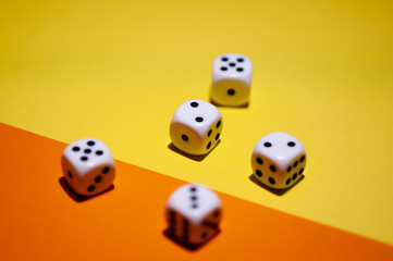 Dice on yellow and orange background