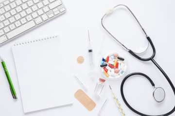 Flat lay medical composition with notepad tempalte