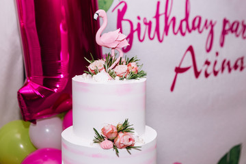 photo of a birthday party with cake and balls