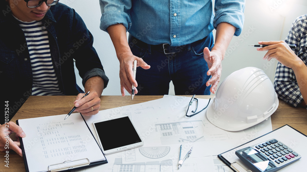 Poster engineer discussing meeting working on blueprint project architectural at construction site.