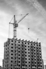 Fototapeta na wymiar Construction of highrise buildings and column crane