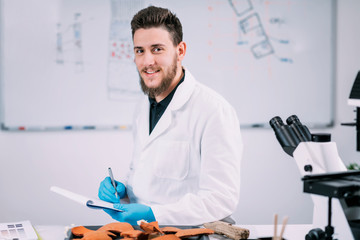 Portrait of Young Male Archaeology Student in Laboratory