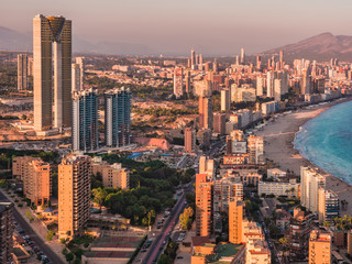 Naklejka na ściany i meble panoramic aerial view of the skyscrapers of the city of Benidorm, Alicante, Valencia, Spain and the beach of poniente , at sunset in summer