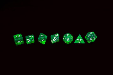 Green dice for fantasy dnd and rpg tabletop games. Board game polyhedral dices with different sides isolated on white background