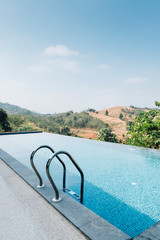 swimming pool with mountain background