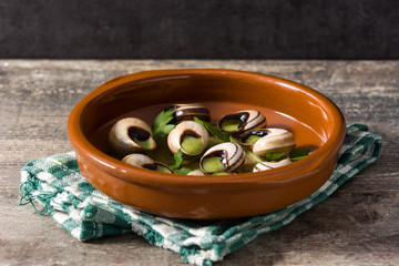Escargots de Bourgogne in brown bowl
