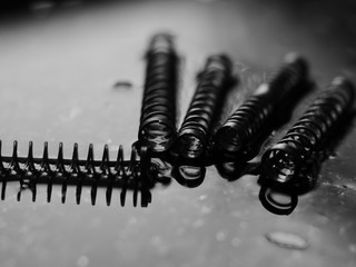 closeup coil spring isolated black background