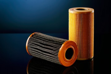 car engine oil filter on dark background
