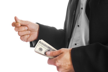 Business man holding money on white background