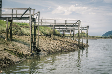 Obraz premium Old wooden docks in the Urdaibai Biosphere Reserve in the Basque Country