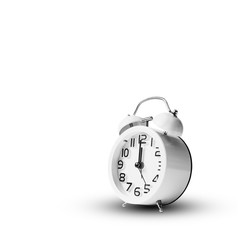 White vintage alarm clock on white background.