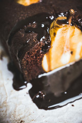 Pear chocolate cake on the rustic background. Selective focus. Shallow depth of field. 