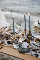 Sea wedding decor on the coast. Evening wedding ceremony near the water