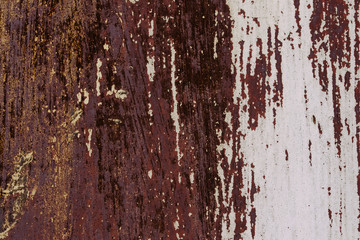 Abstract colorful wall texture and background. Close-up iron surface with old white and brown paint