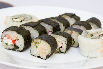 Japanese cuisine, rice sushi and fish - closeup