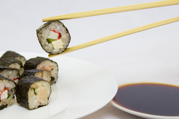Japanese cuisine, rice sushi and fish - closeup