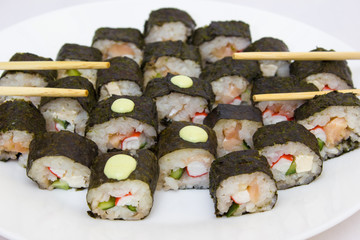 Japanese cuisine, rice sushi and fish - closeup