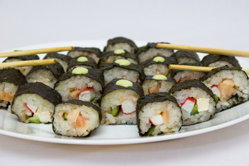 Japanese cuisine, rice sushi and fish - closeup