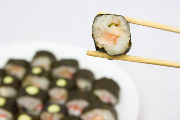 Japanese cuisine, rice sushi and fish - closeup