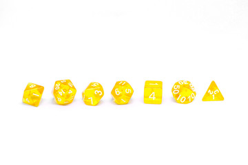 Yellow dices for fantasy dnd and rpg tabletop games. Board game polyhedral dices with different sides isolated on white background