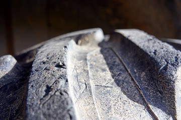 Close-up of tractor tyre texture detail. Background.