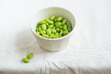 Edamame beans on bowl on a table