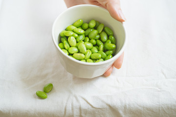 Edamame beans on bowl on a table