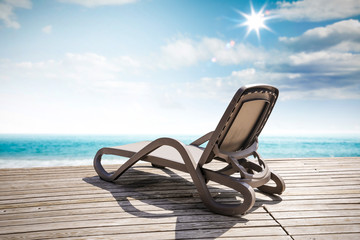 Obraz premium Summer chair on wooden pier and sunny day. Free space for your decoration. 