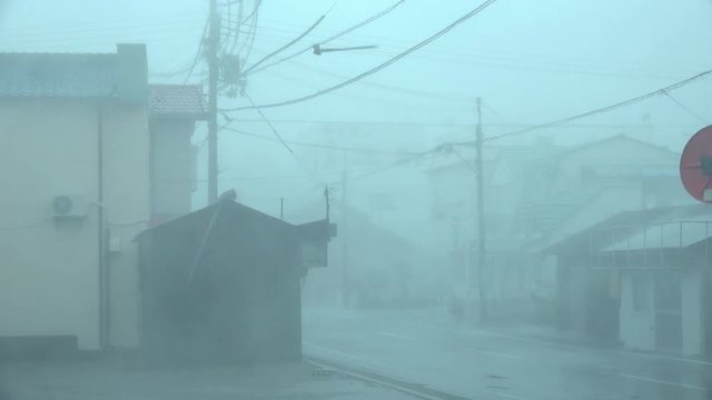 Violent Hurricane Winds Blow Roofing Materials Through Air In Major Storm - Jebi