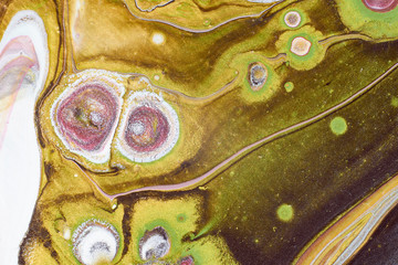 Abstract color spots with a predominance of white and interspersed with green, purple and yellow