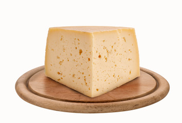 Piece of asiago cheese shape on round wooden plate, isolated on white