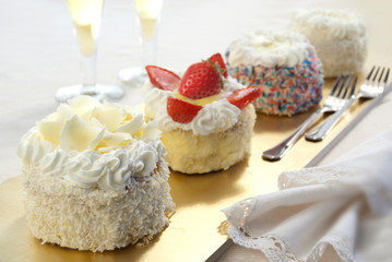 Four Chantilly little dessert, monoportion cake decorated with strawberry and cream