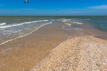 sea white wave on the sand hall. blue sea and sky