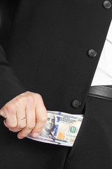 Business man holding money on white background