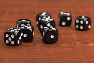 Dice on a wooden table. Concept for business risk.
