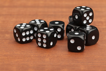 Dice on a wooden table. Concept for business risk.