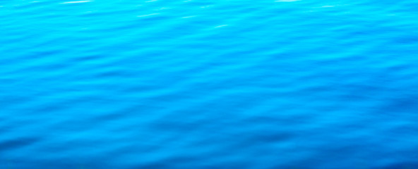 Water abstract background. Blue water ripples texture pattern.