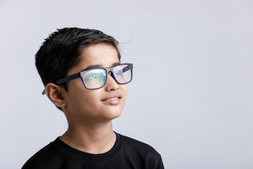 Cute little Indian / Asian boy wearing spectacles