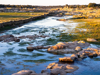 View of a section of the reservoir of La Almendra in Salamanca (Spain) in winter dry season